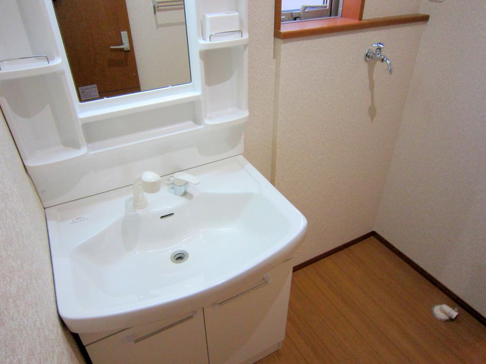 Wash basin, toilet. Washbasin with shower to change the living comfortable