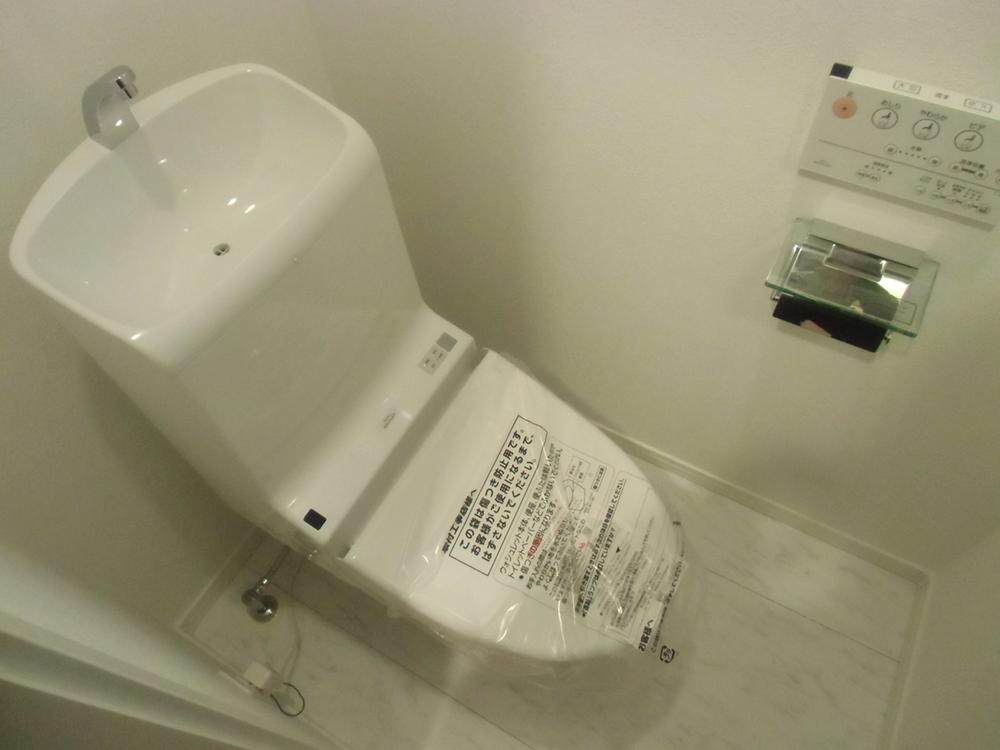 Toilet. WC of Washlet! Paper holder is fashionable plating type.