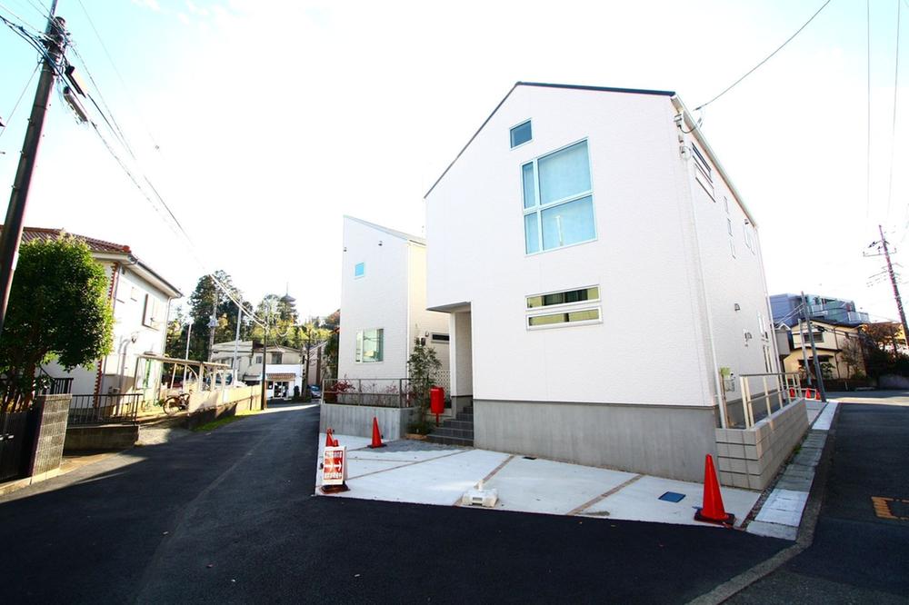 Local photos, including front road. All six buildings of the stylish new construction condominiums.