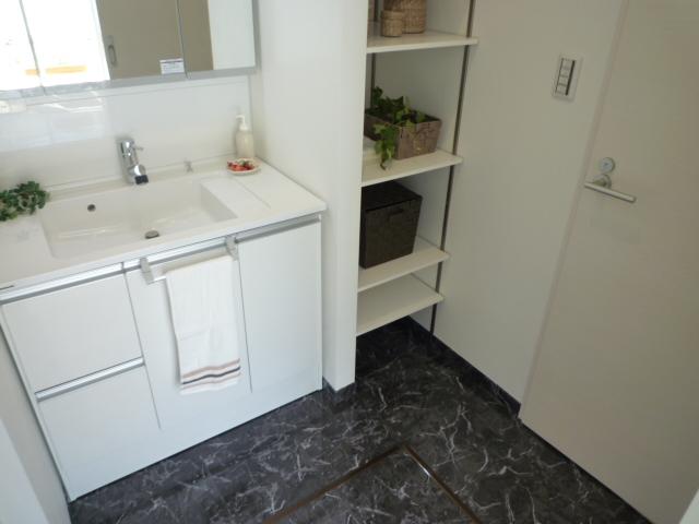 Wash basin, toilet. Wash basin is three-sided mirror, Shower is equipped