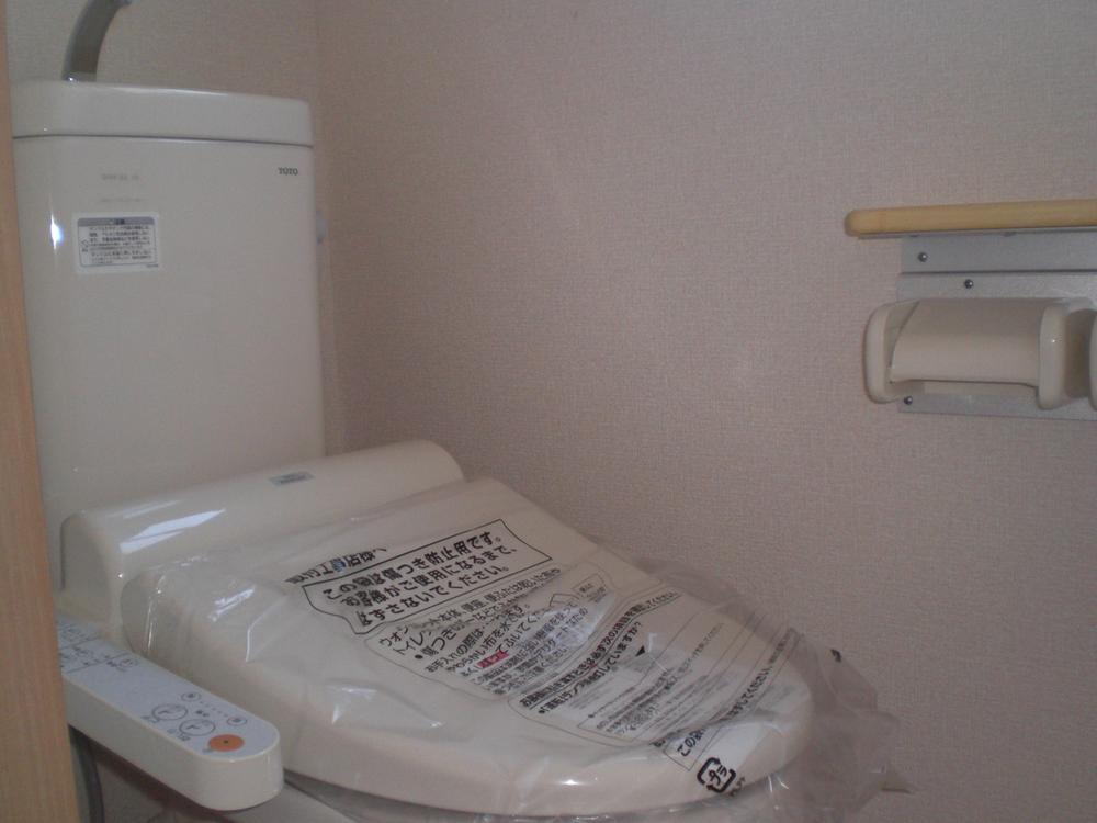 Toilet. Safety because the handrail is attached