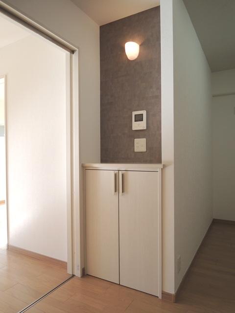 Living. We established a convenient storage with a counter to be in the dining space.