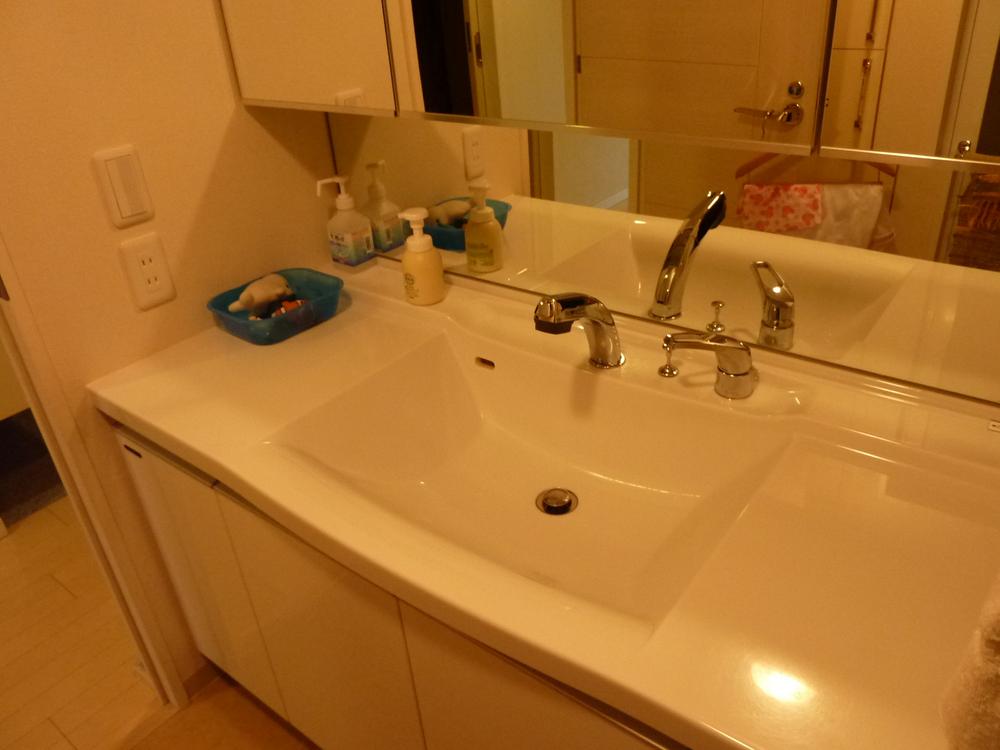 Wash basin, toilet. Large is a wash basin and spacious.