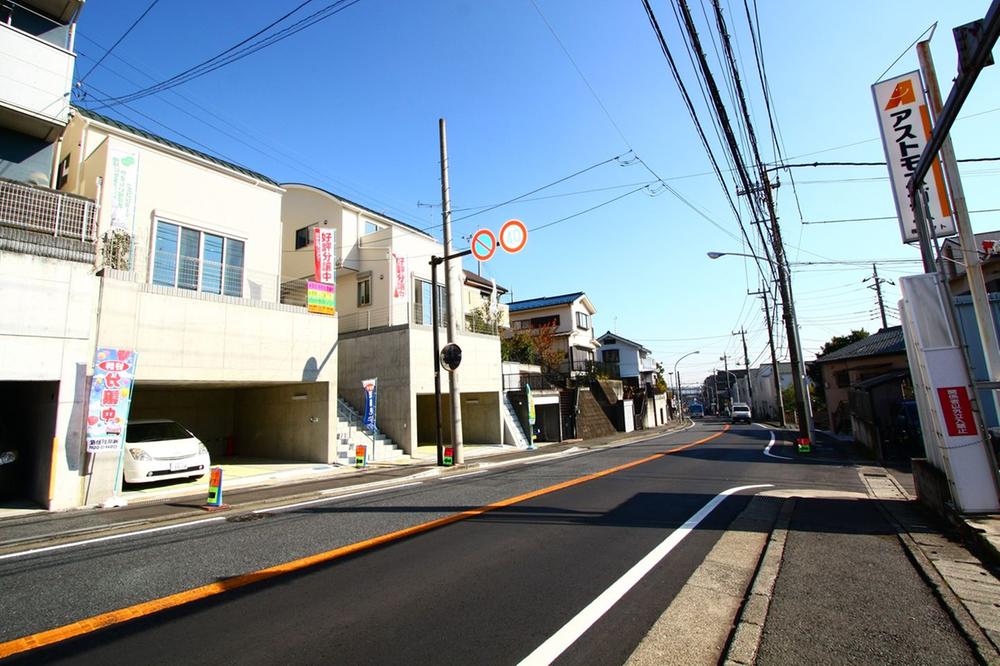 Local photos, including front road. Front road is with sidewalk.