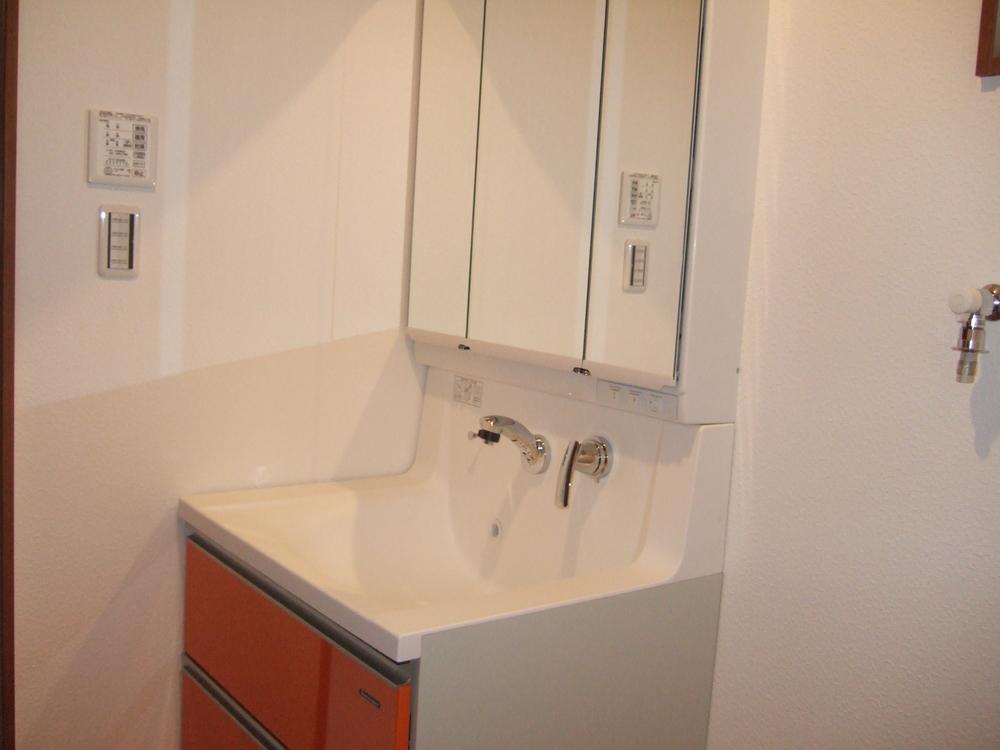 Wash basin, toilet. Wash room with a storage