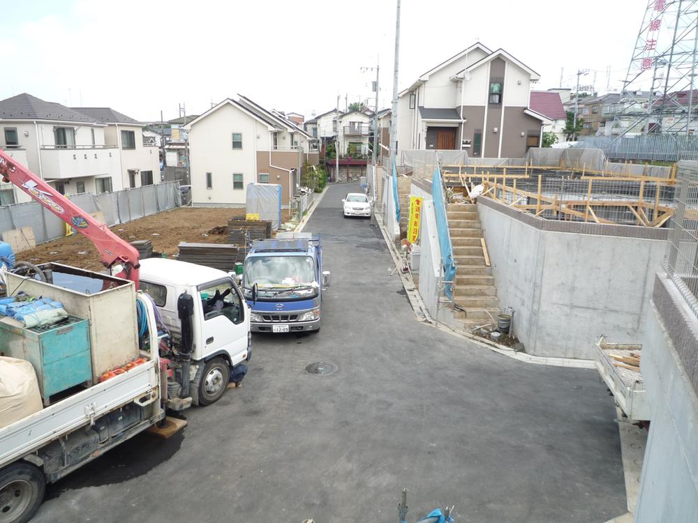 Local photos, including front road. The building is the whole of the pre-construction work.