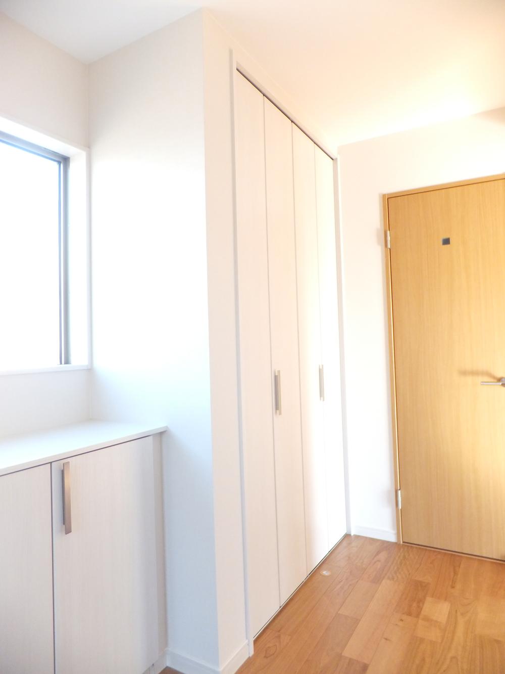 Entrance. Closet next to the shoe box. It can also be used for over coat.