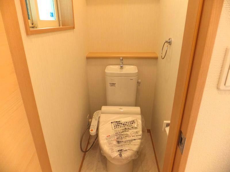 Toilet. Toilet with a window is bright.