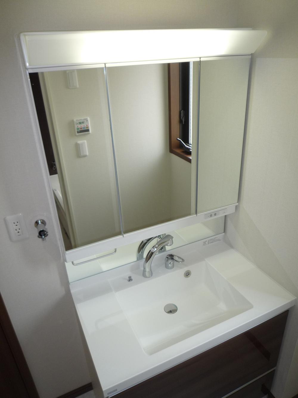 Wash basin, toilet. Vanity is vanity shower. 