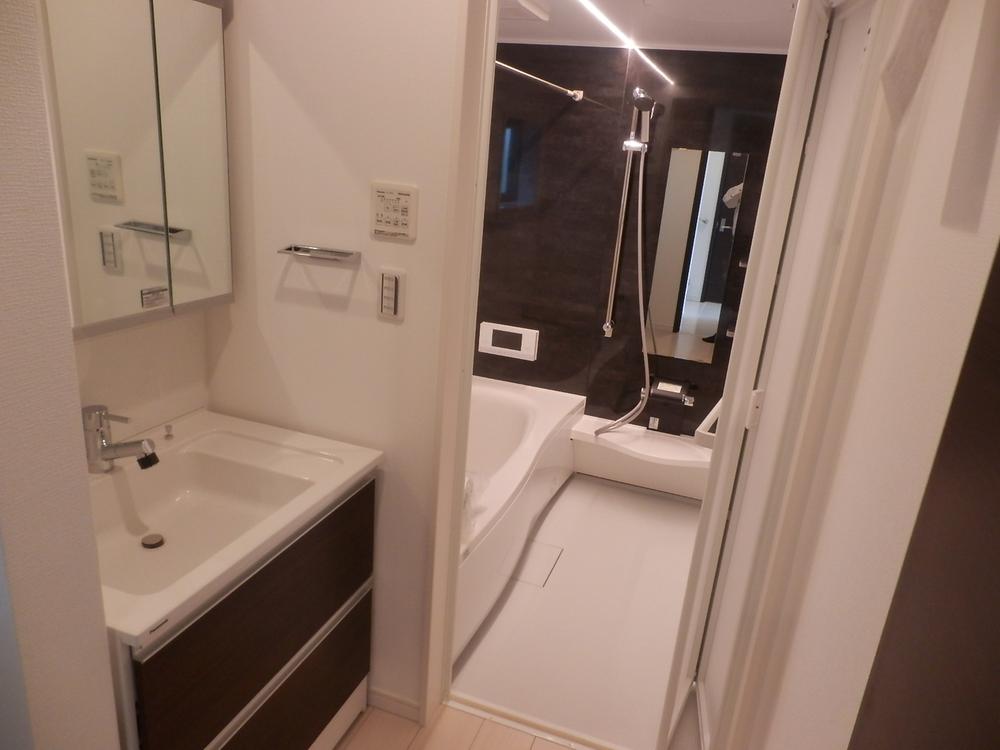 Wash basin, toilet. It is a photograph of the washroom!