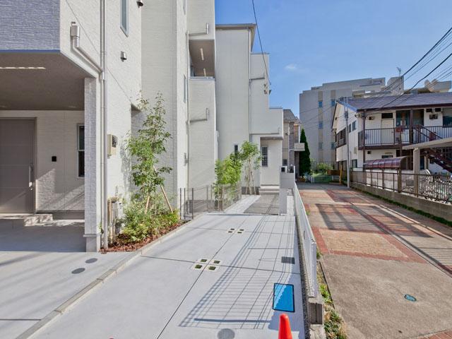 Local photos, including front road. C Building local appearance photo  Living Pledge 18.04