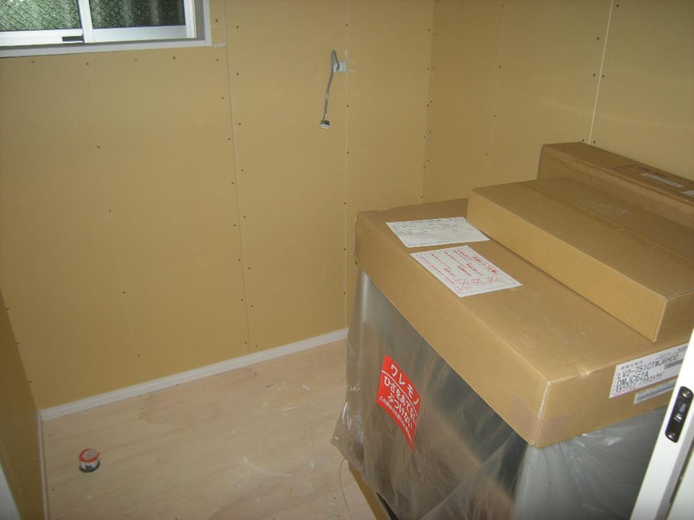 Wash basin, toilet. It is the washroom