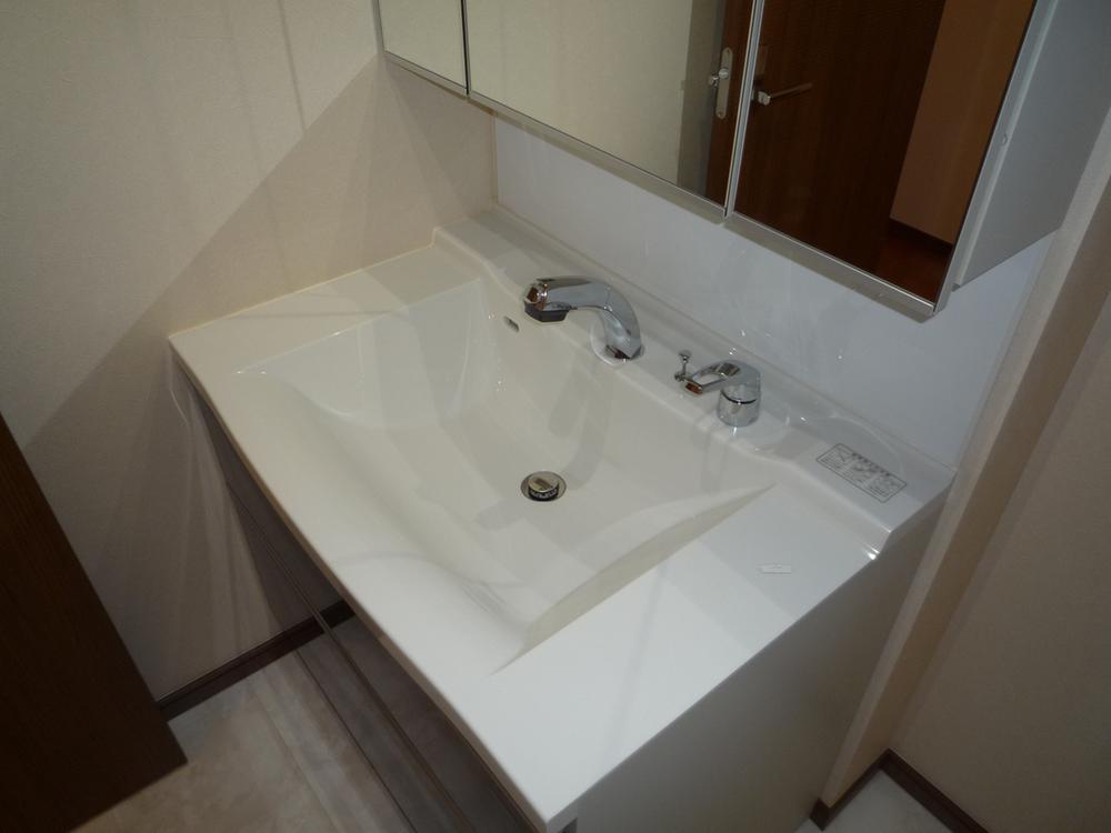 Wash basin, toilet. Vanity is vanity shower. 