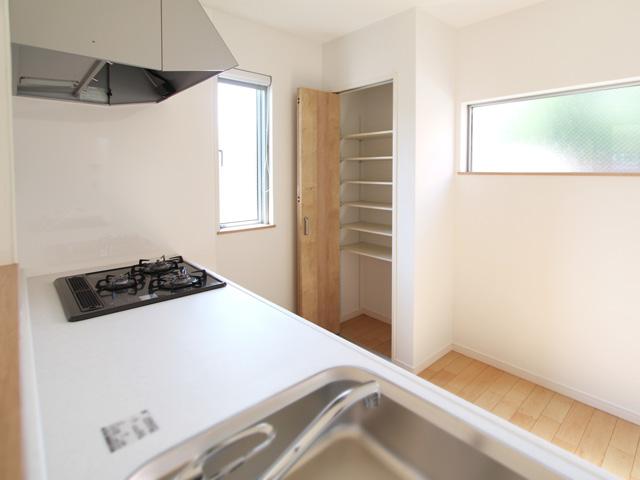 Kitchen. Behind the kitchen was set up a cupboard with a door. This is convenient for storage of kitchen utensils and food.