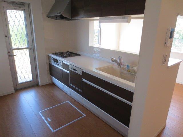 Living. Overlooking the living room from the kitchen side