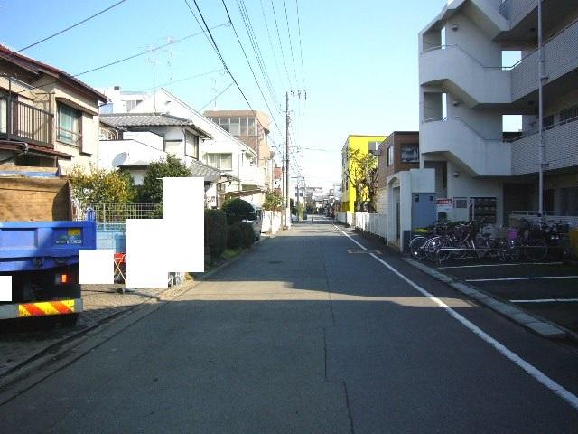 Local photos, including front road. Adjacent road (south 6m public road)