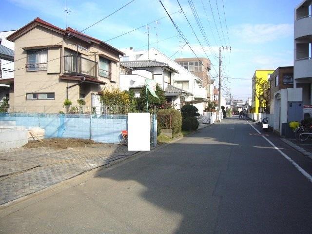 Local photos, including front road. Adjacent road (south 6m public road)