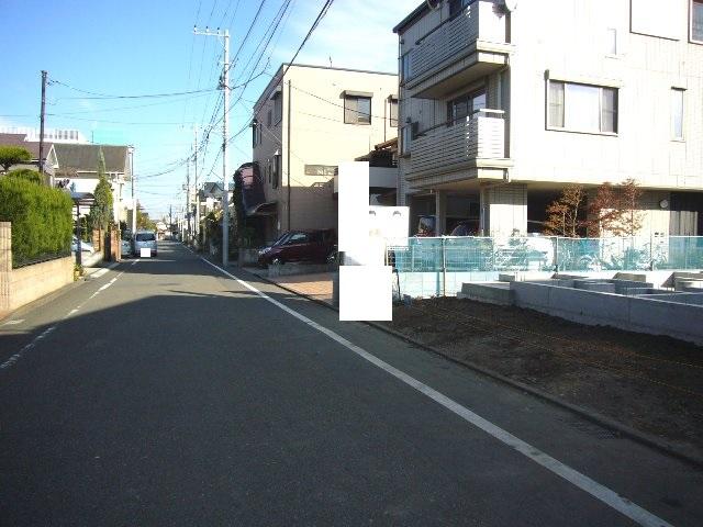 Local photos, including front road. Adjacent road (north 6m)