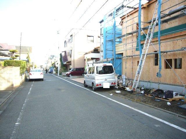 Local photos, including front road. Adjacent road (north 6m)