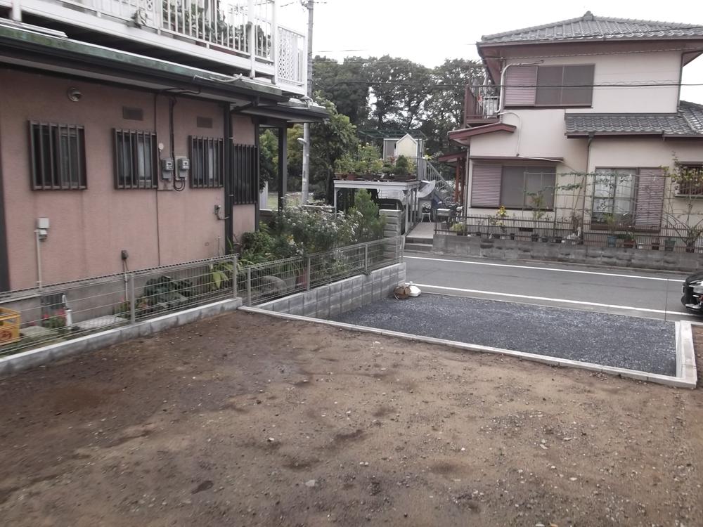 Parking lot. It is part of the garden of the car space as seen from the balcony.