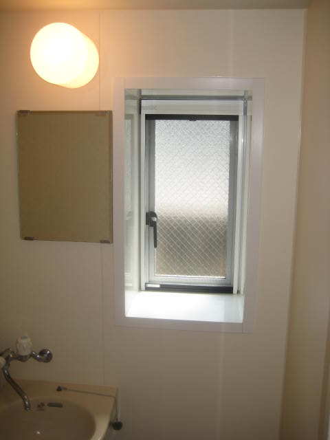 Bath. There is a window in the bathroom.