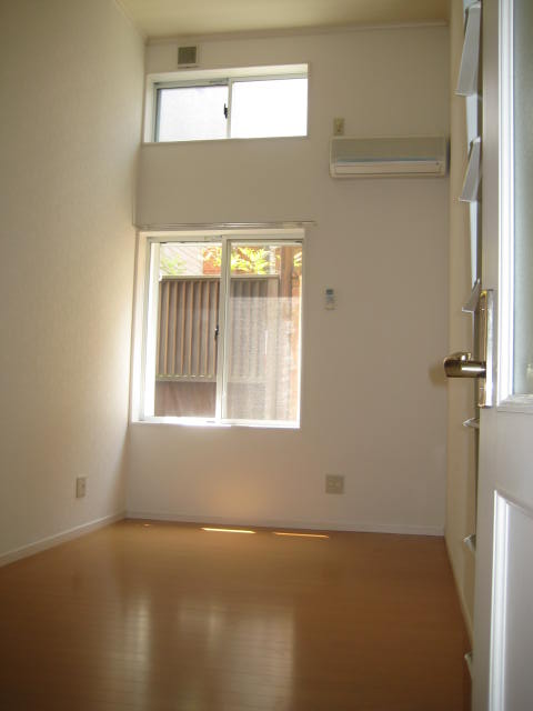 Living and room. The ceiling is high open because there is a loft.