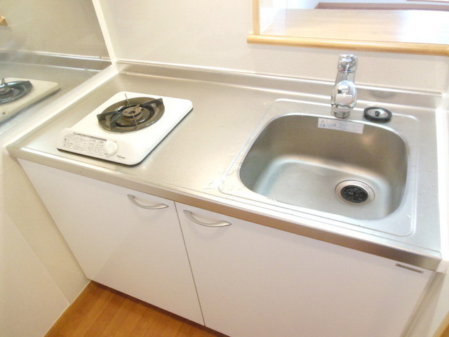 Kitchen. Bite is a gas stove in the kitchen