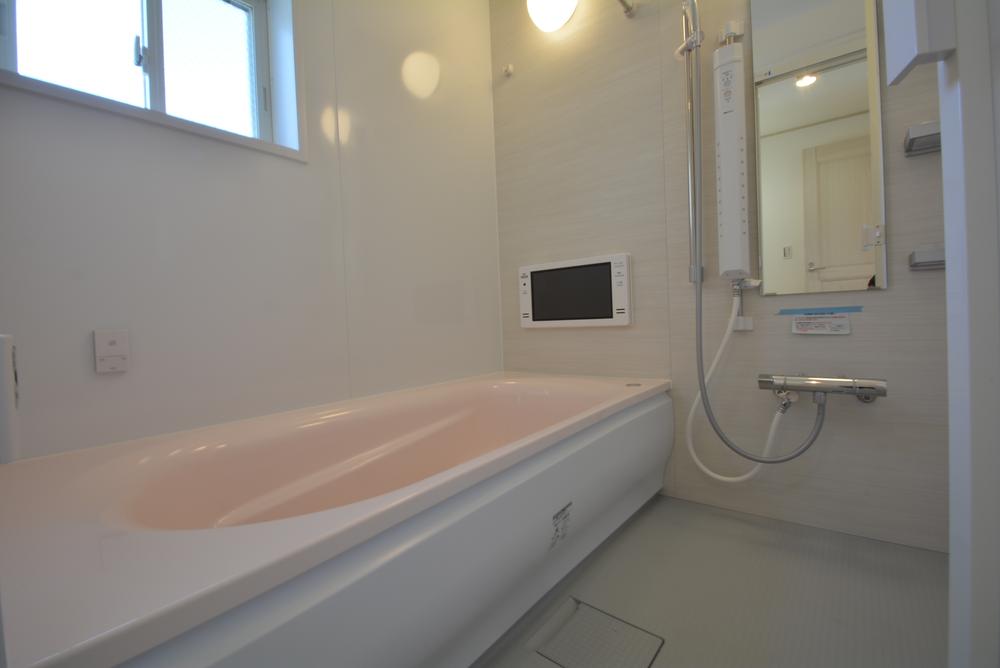 Bathroom. Please take your tired of the day stretched out his leg with a large bath with a bathroom TV