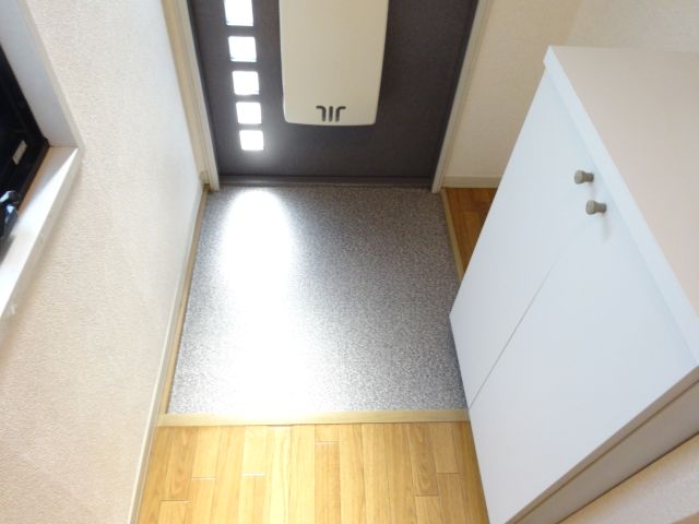 Entrance. Cupboard is attached to the front door