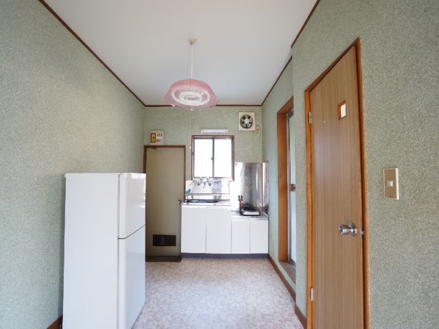 Kitchen. Gas range and fridge