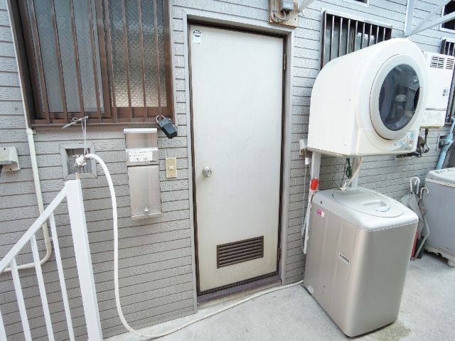 Entrance. Washer and dryer to the right