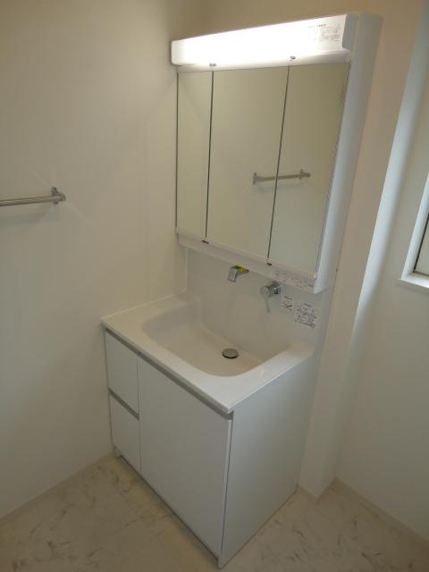 Wash basin, toilet. A Building Bathroom vanity