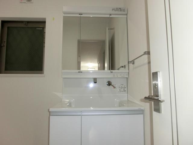 Wash basin, toilet. H Building