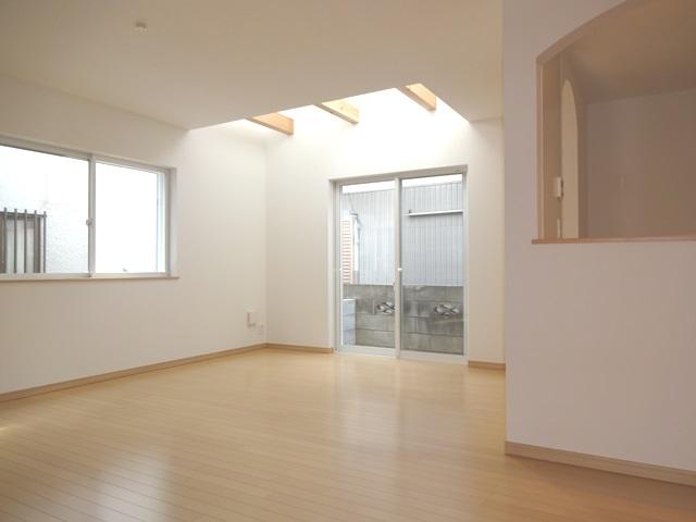 Living. Building 2 Bright living room with vaulted ceiling