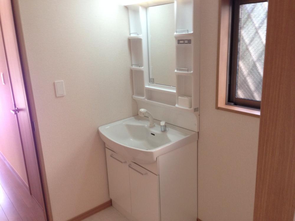 Wash basin, toilet. Dresser with shower