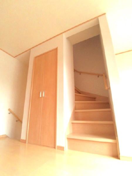 Living. Second floor storage and stairs