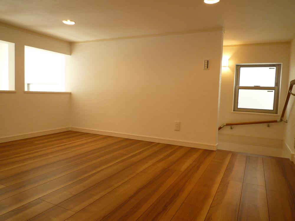 Non-living room. For the stairs instead of the ladder to the loft, It could use as a room for children. 