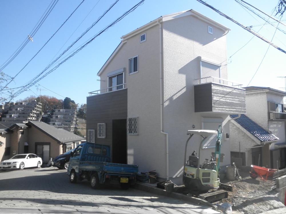 Local photos, including front road. Located in the northwest corner lot. Image right of parking spaces, It is scheduled for completion in December (December 12, 2013) Shooting