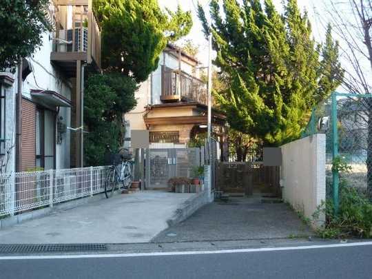 Local land photo. The property entrance side (west) 1