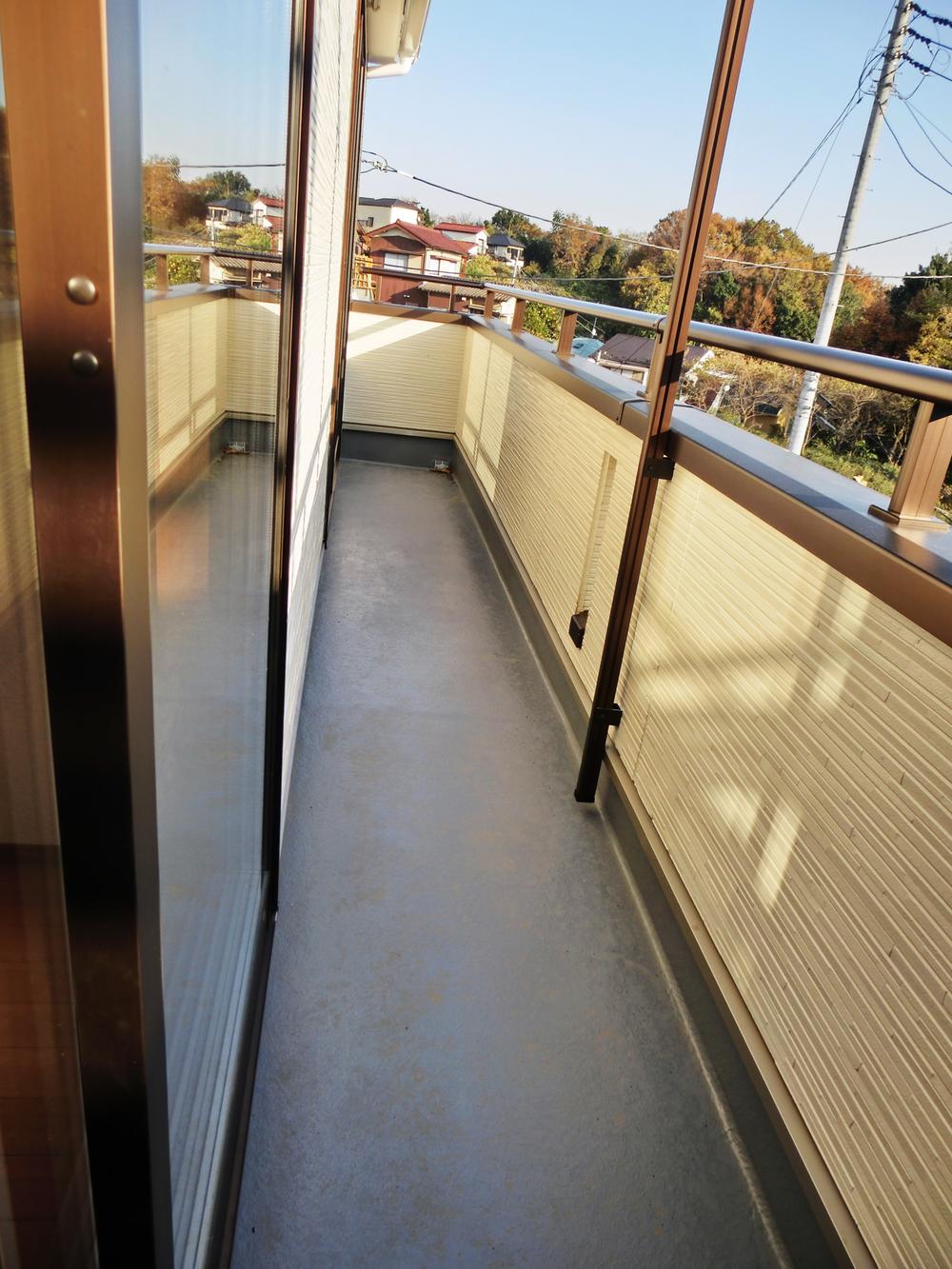 Balcony. Long balcony that leads to two rooms