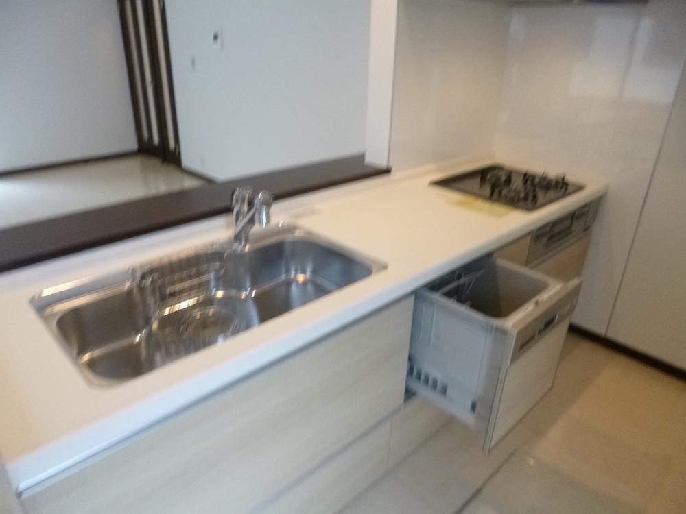 Kitchen. B Building Dishwasher!