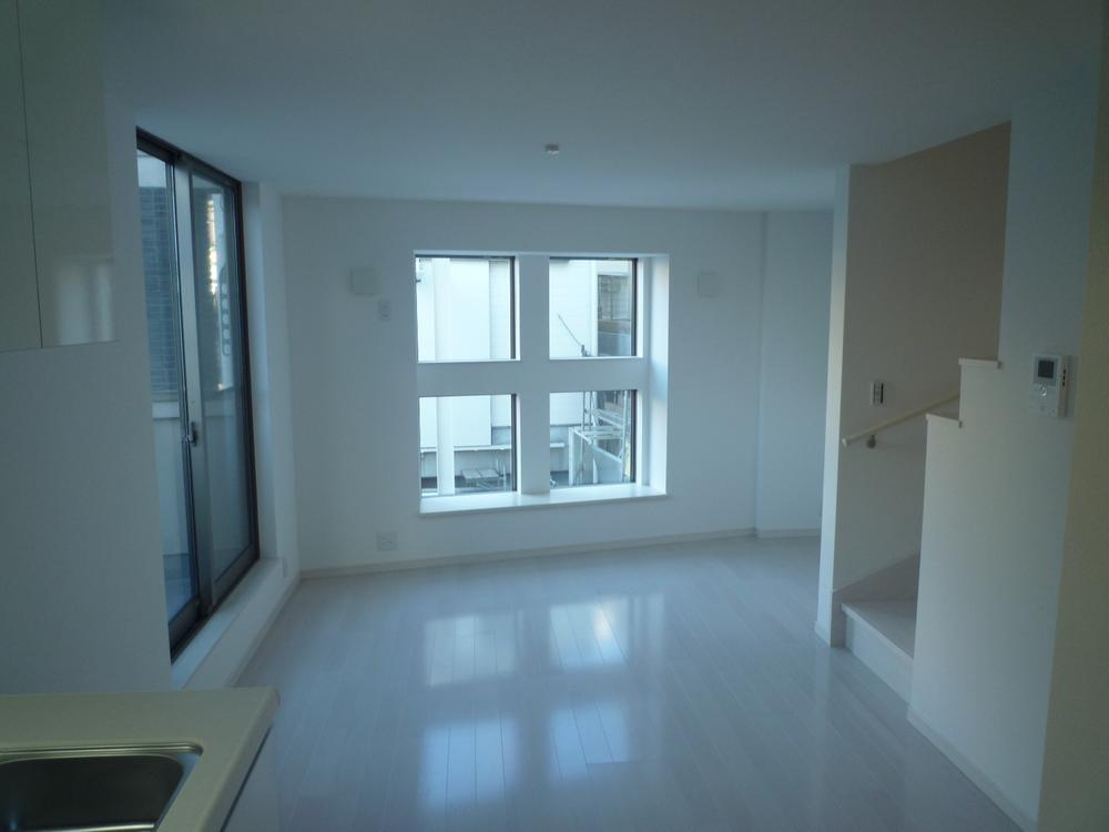 Living. Spacious living room of the white was the keynote interior.