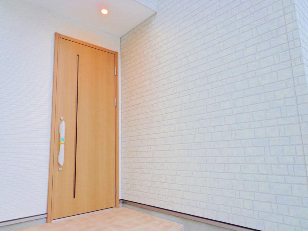 Entrance. Entrance door of the outer wall and Sulfur butterfly, Entrance approach down lights witty.