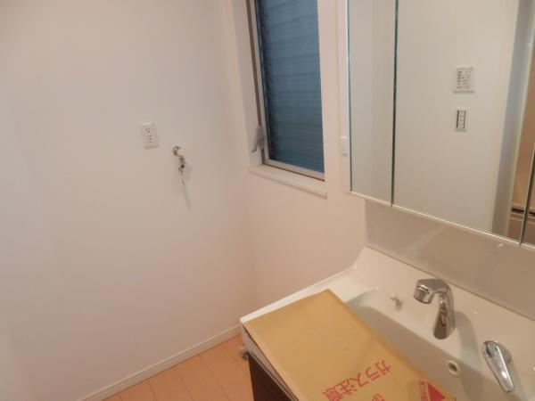 Wash basin, toilet. It is a photograph of the washroom