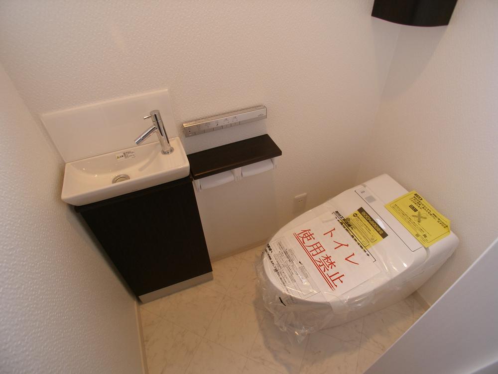 Toilet. Hand wash basin with a toilet!