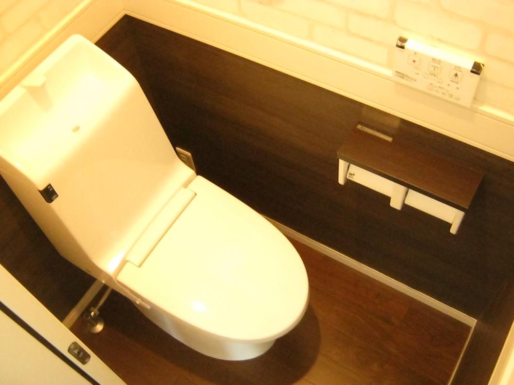 Toilet. Toilet stuck to interior design.