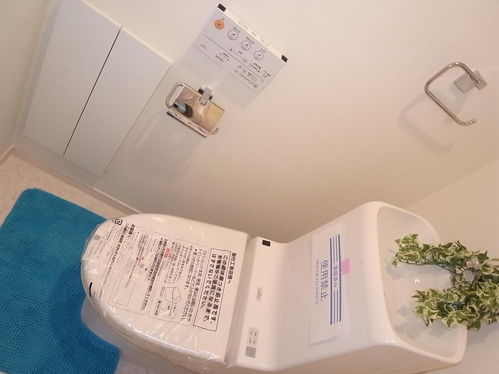 Toilet. Warm water cleaning toilet seat with toilet. Toilet is also clean with storage!