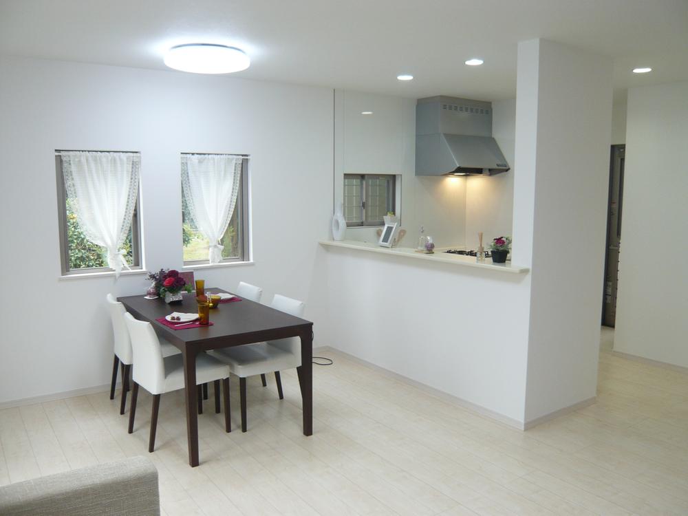 Living. The room is bright tones and white room. 