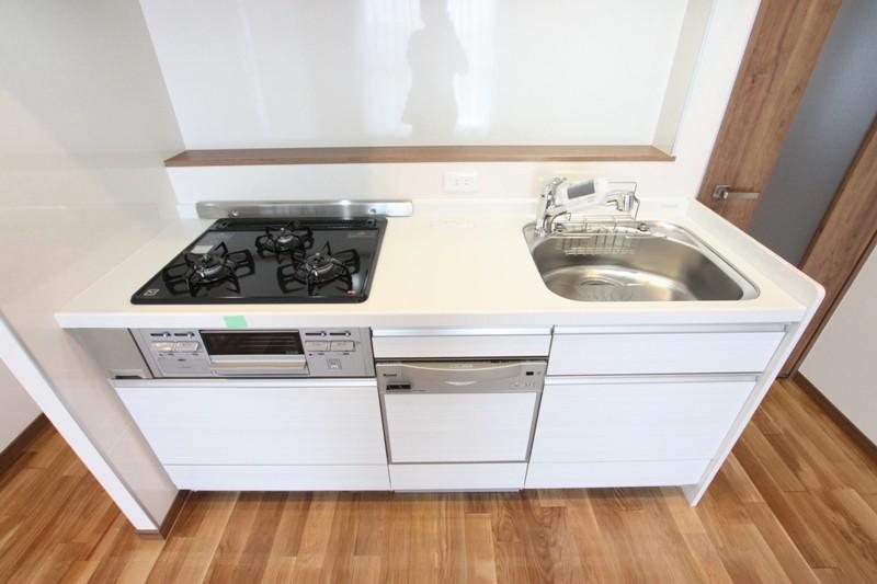 Kitchen. Gas stove with a grill is a three-necked