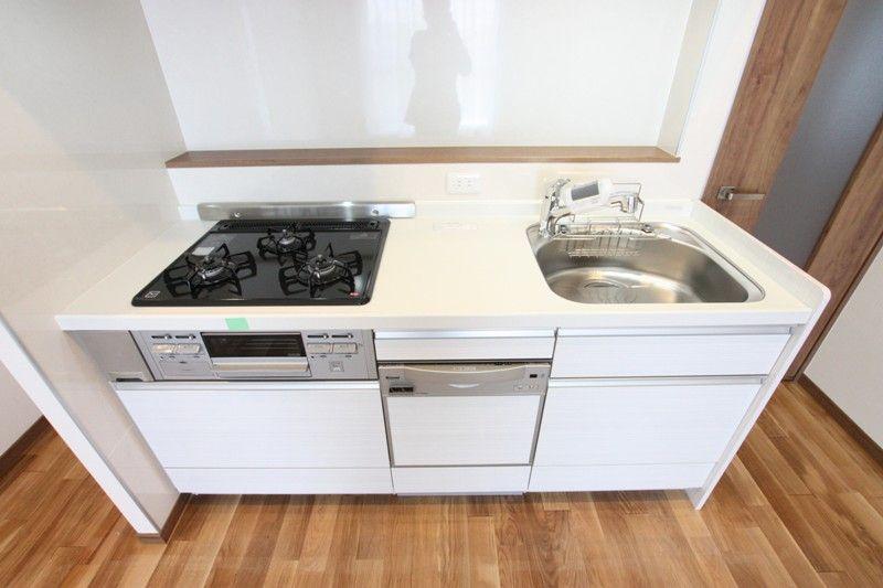 Kitchen. Gas stove with a grill is a three-necked